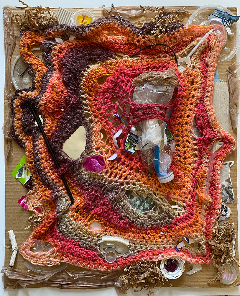 Woven Waste: Discarded items are placed together on a piece of cardboard.