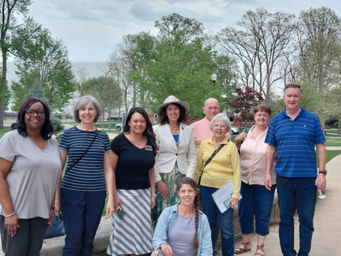a group of people smiling outdoors