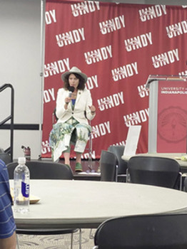 a woman speaking onstage