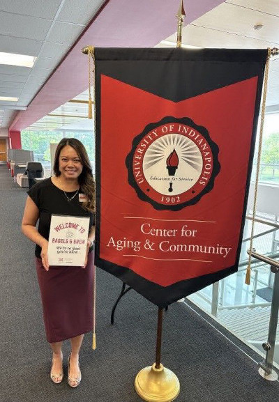 CAC executive with welcome sign