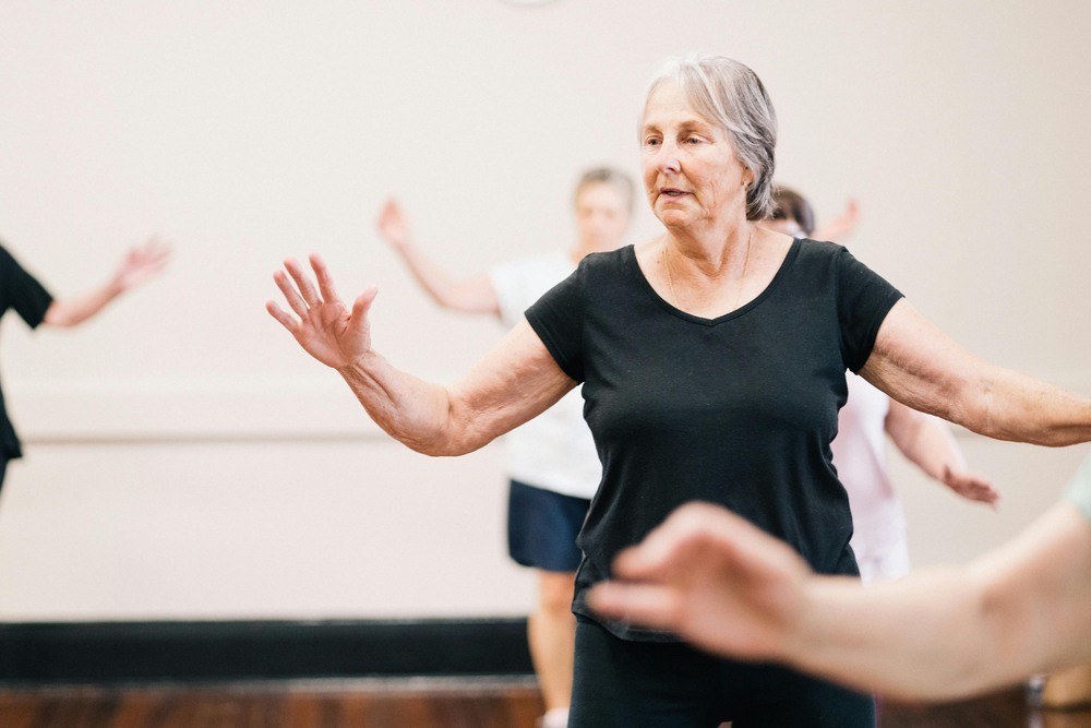 senior woman exercising with her hands up