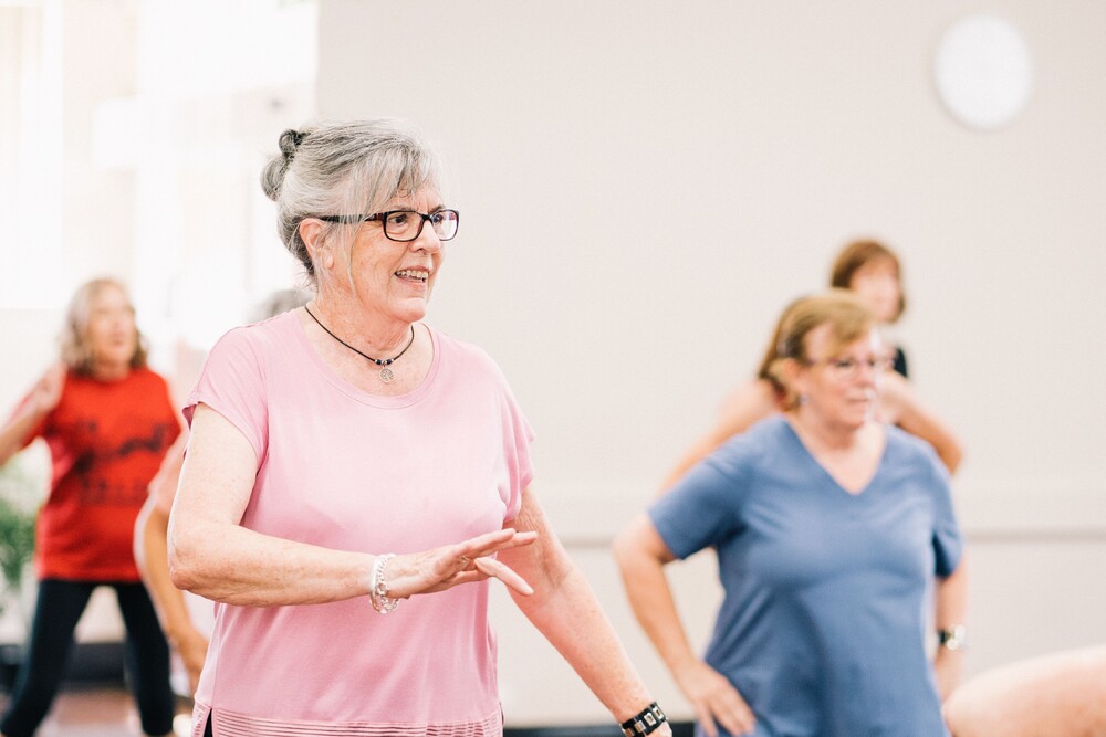 a group of older adults in an exercise class