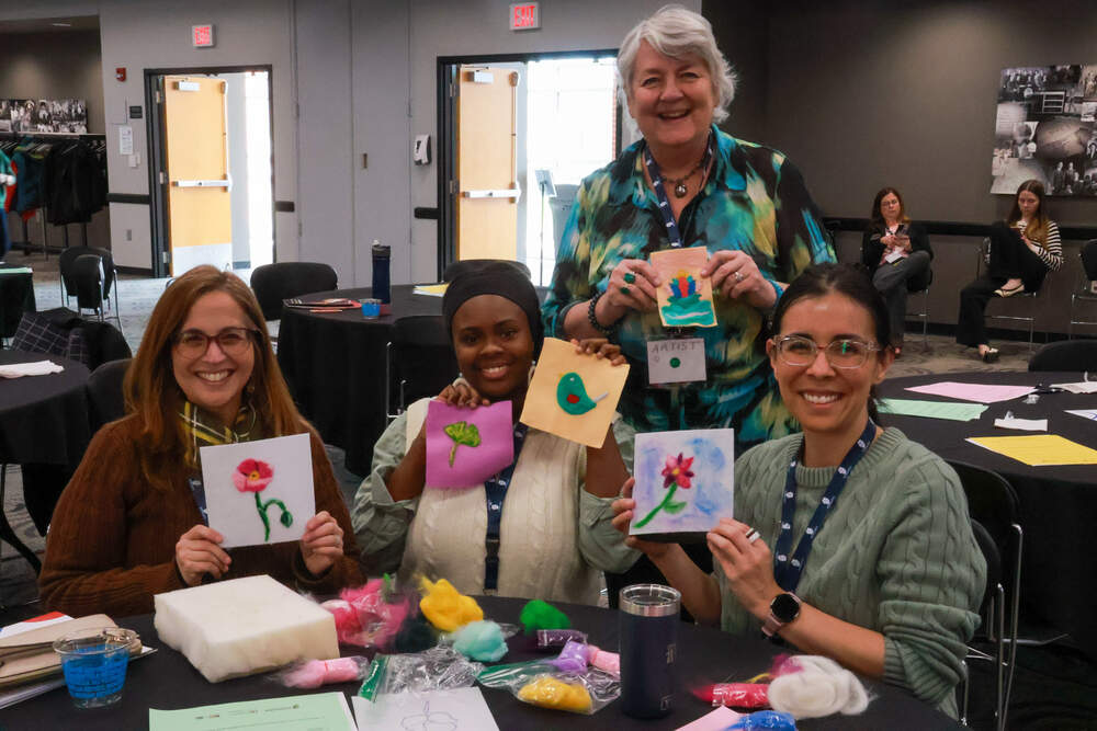 A group of people with felt art