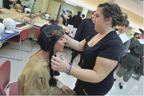 students putting on makeup in the dressing room