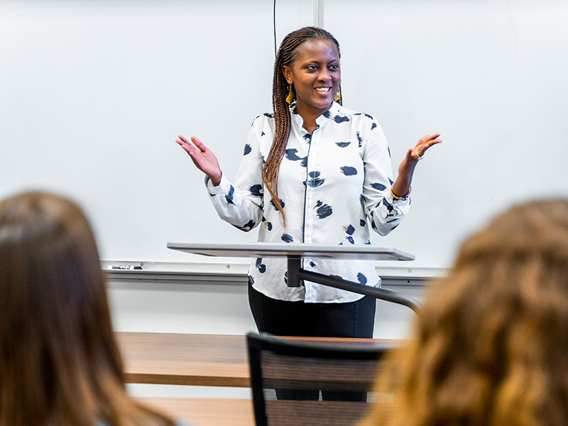 woman talking in front of class