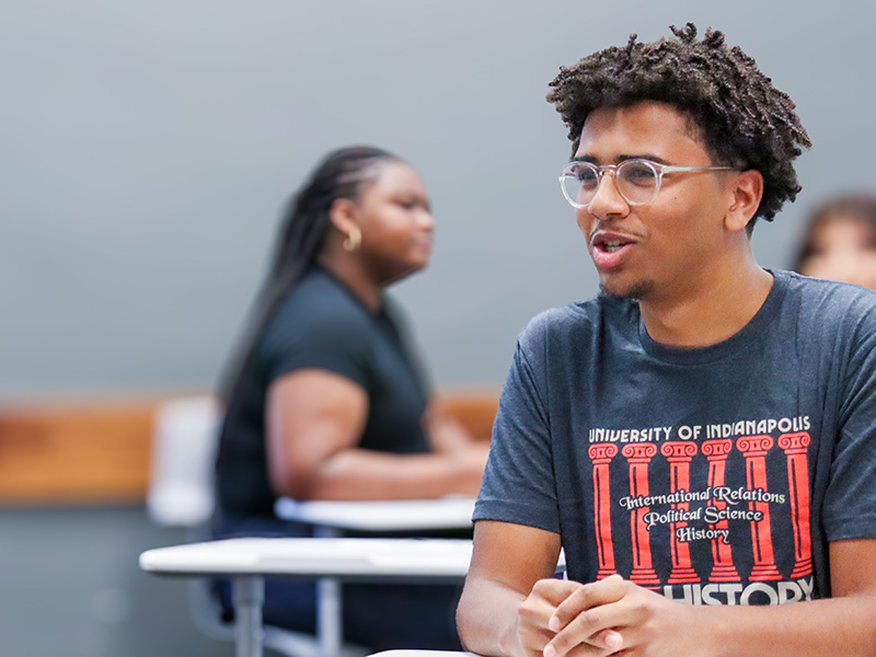 student participating in a discussion