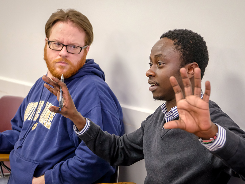 student is talking as another student is listening