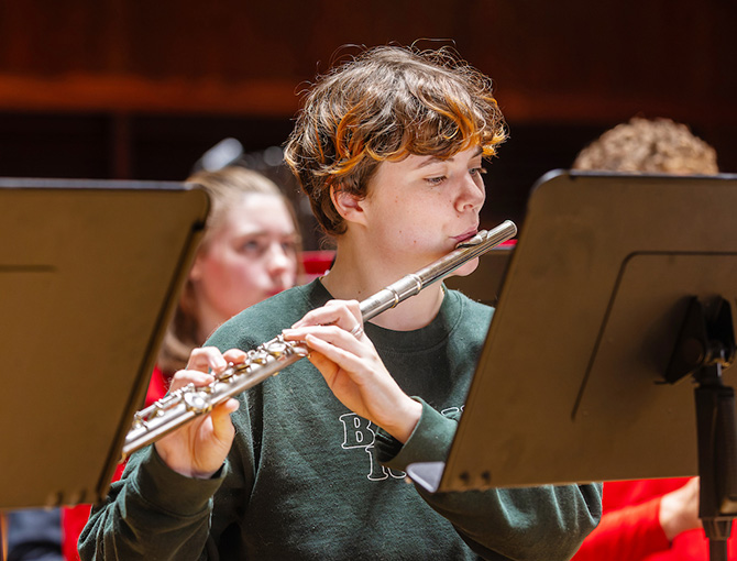 student playing an instrument