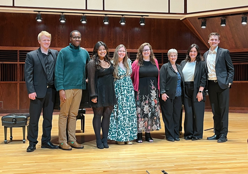 ashley dixon with masterclass students on stage