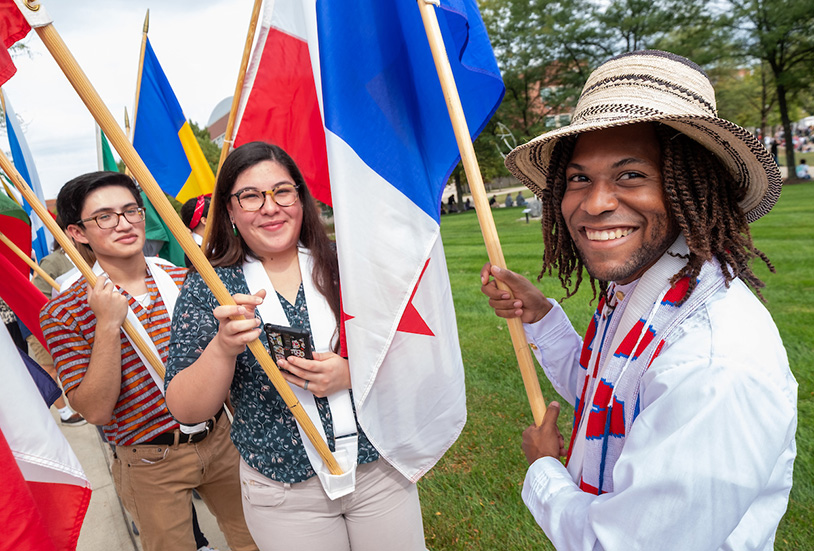 students holding flags of different countries