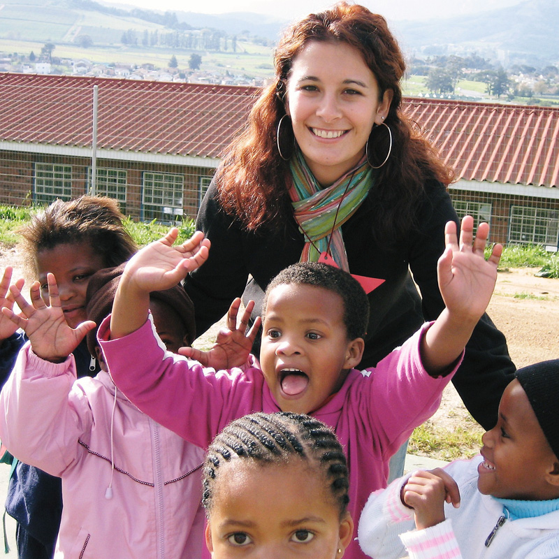 student in a foreign country with happy chlidren