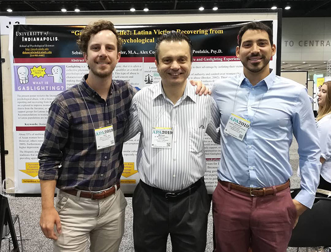 Michael Poulakis with 2 students