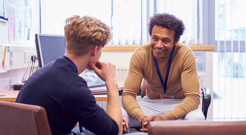 social worker talking to a young man