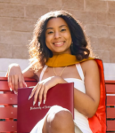young lady holding her diploma