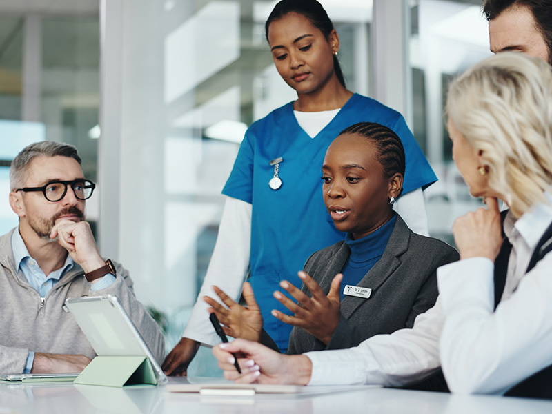 health administrator meeting with healthcare workers