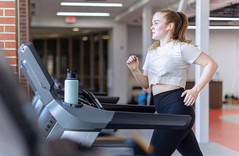 women running on a threadmill