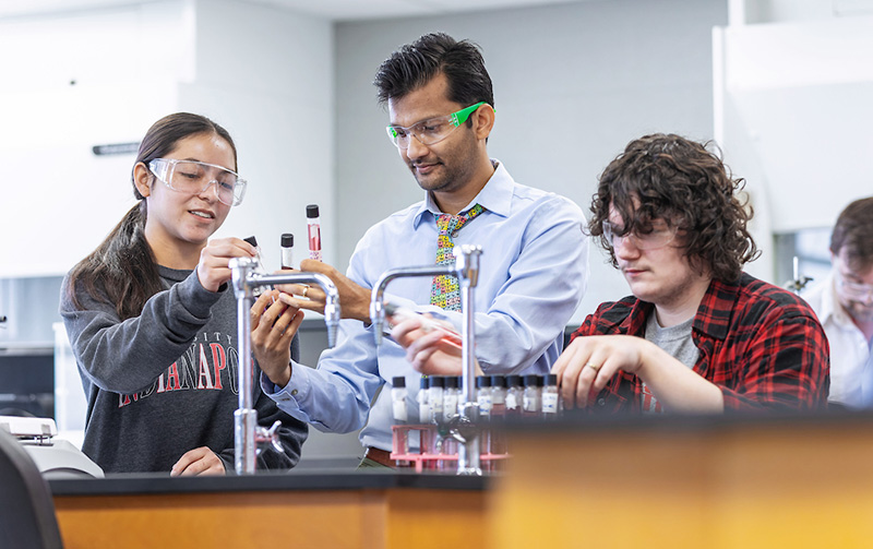 professor and students in a science lab