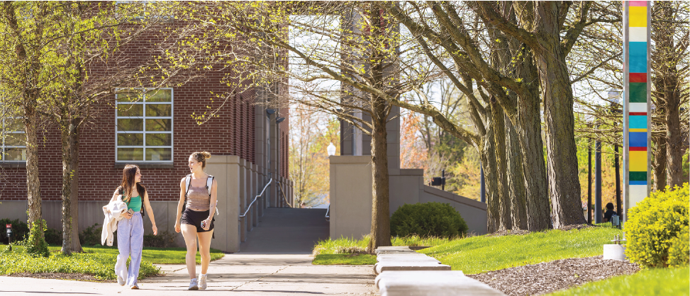 Two ladies walking on campus