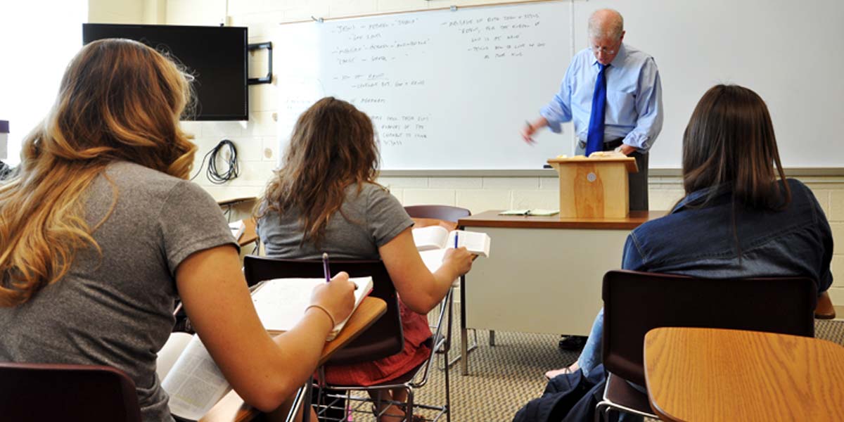 students in class, taking notes