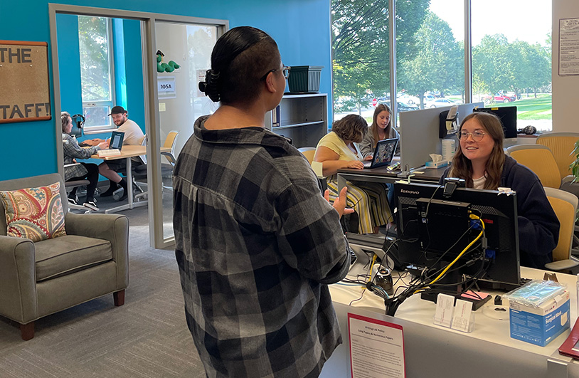 several students and staff in the writing lab