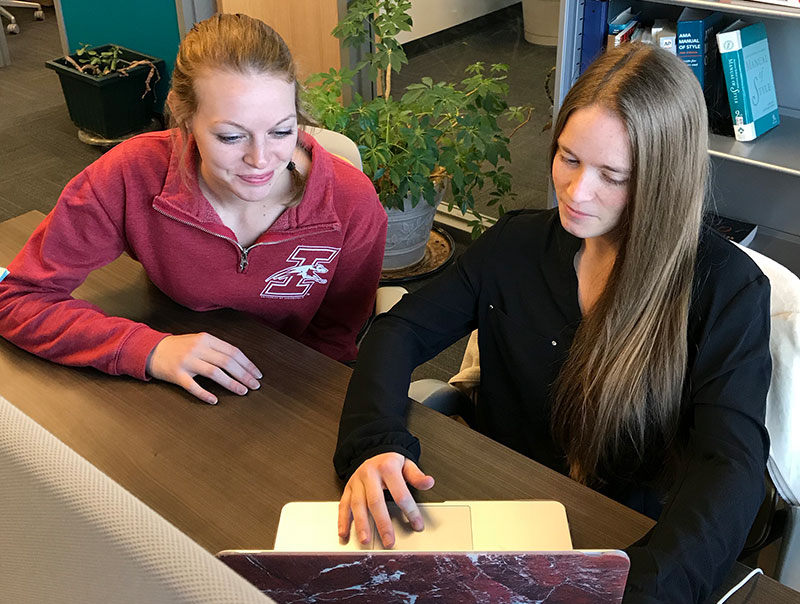two women working together in the writing lab